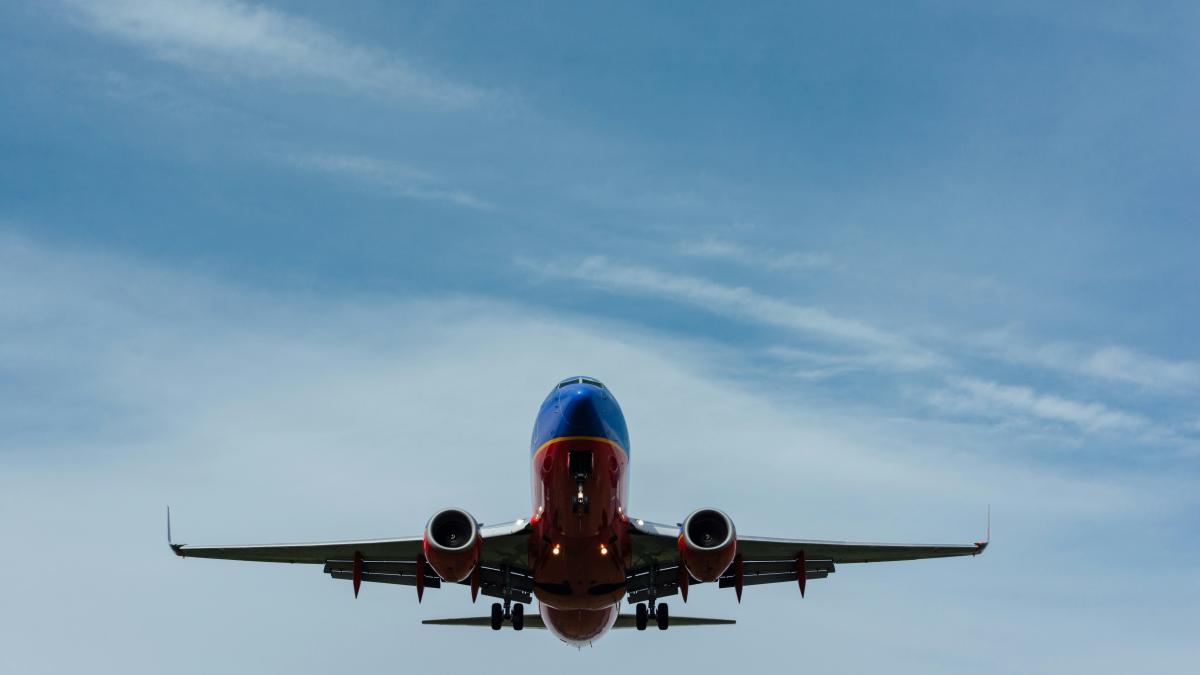 Image of airplane flying in the sky.