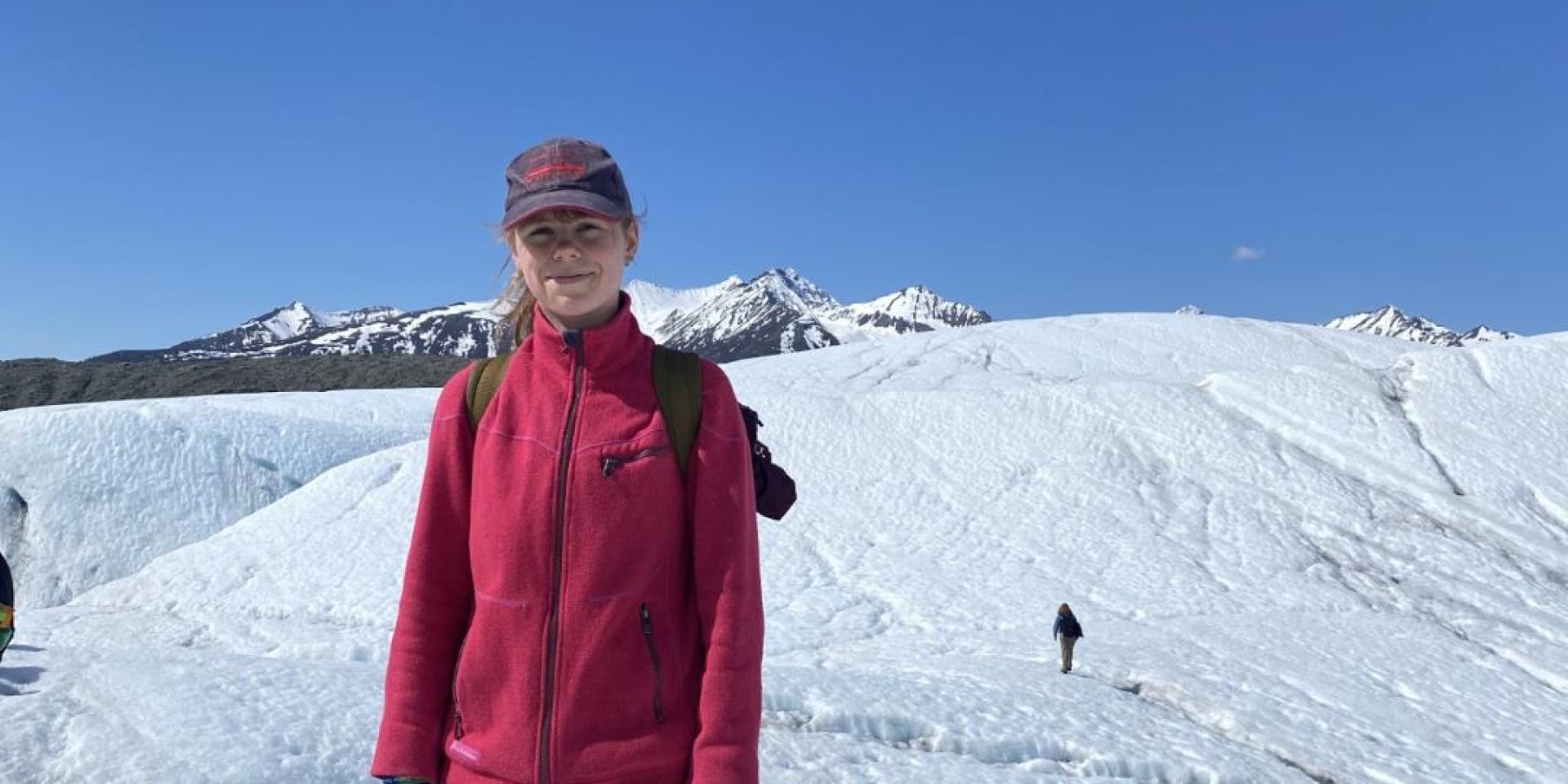 Student standing on glacier