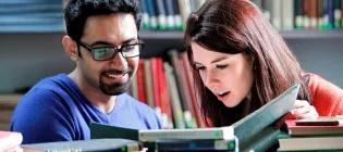 Students converse in the library 