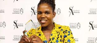 Forget Shareka smiling at the camera holding a clear glass trophy..