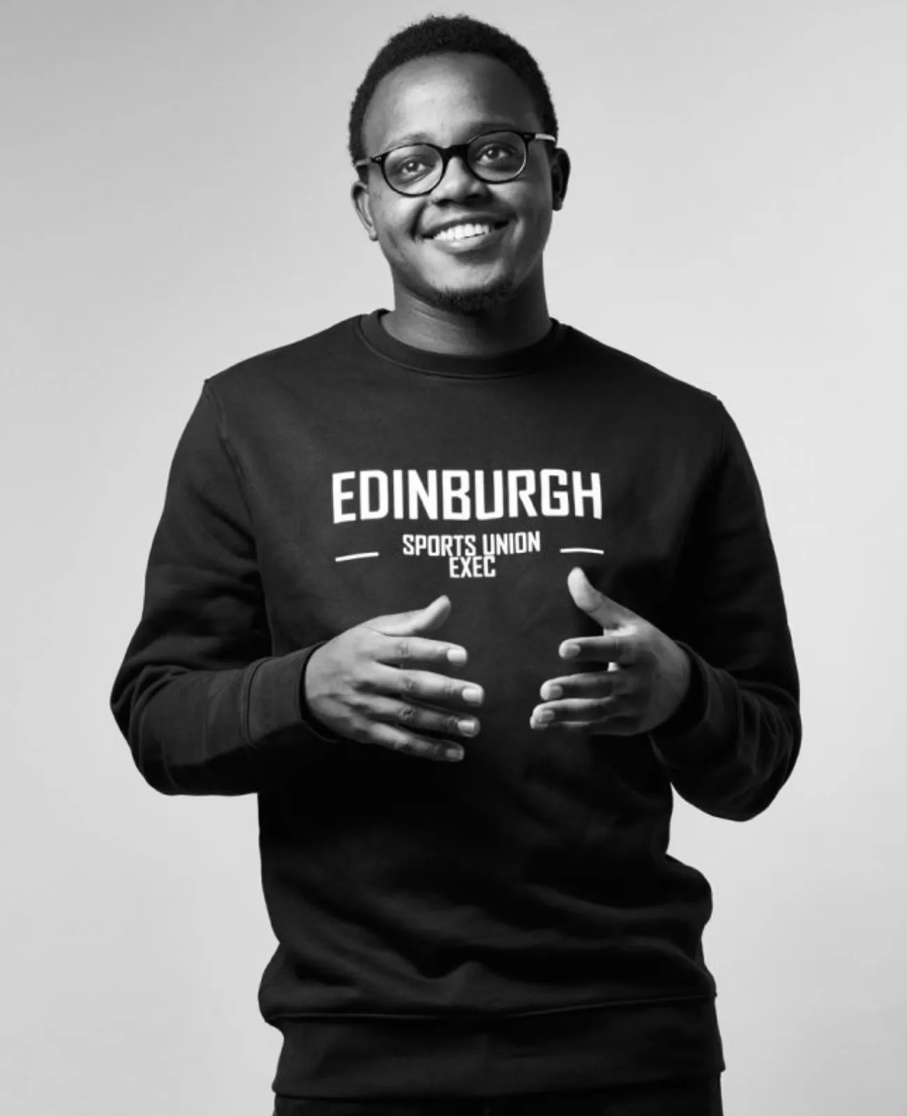 Daniel Mutia smiling in monochrome