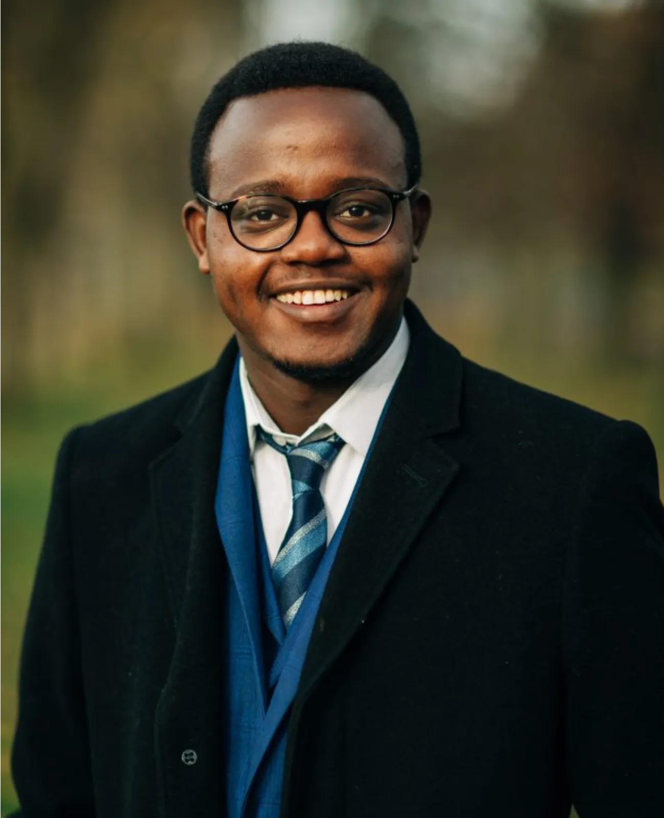 Daniel mutia smiling outdoors