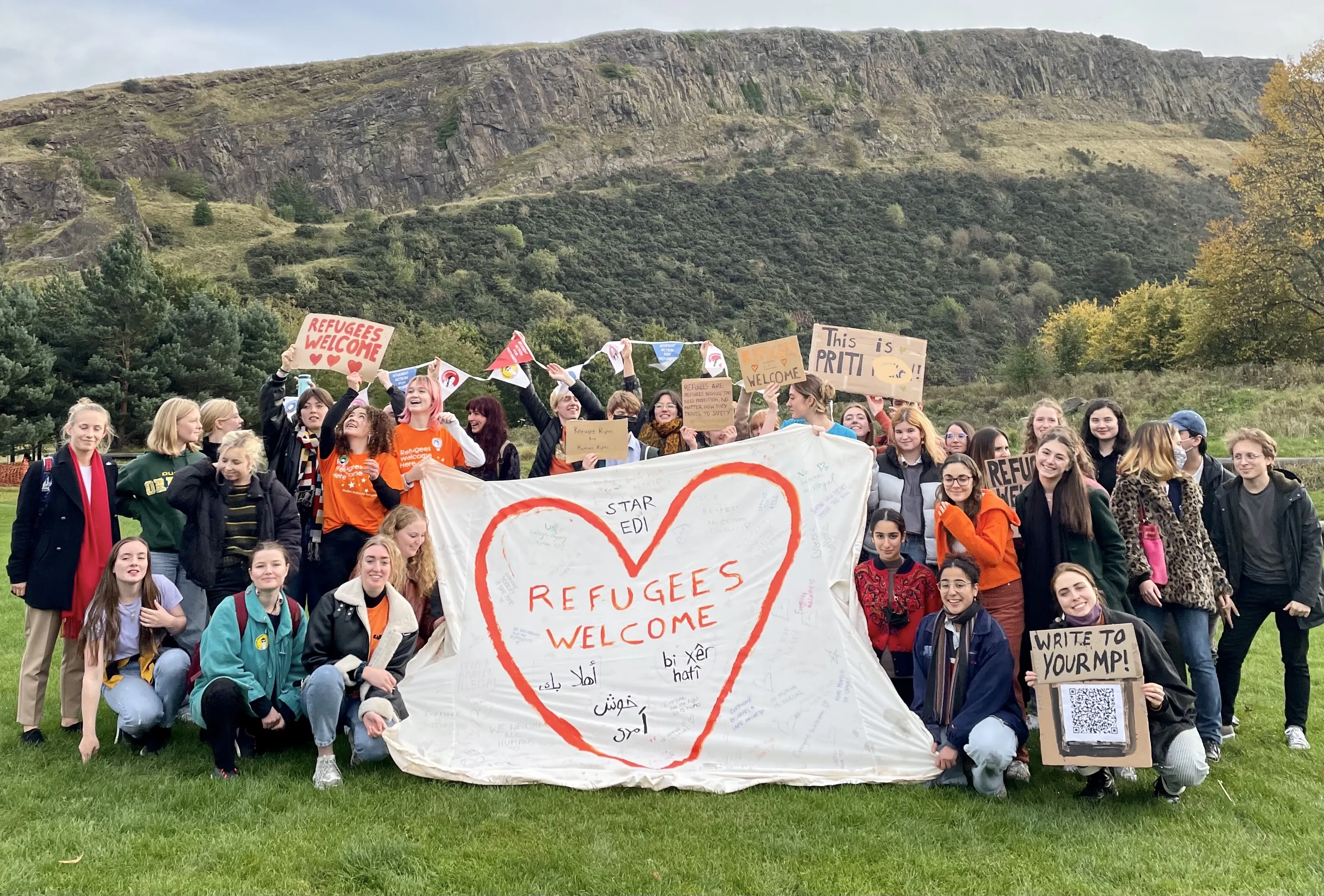 Students from STAR Edinburgh holding a sign saying Refugees Welcome