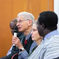Man speaking into microphone