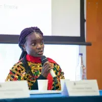 Woman speaking into microphone