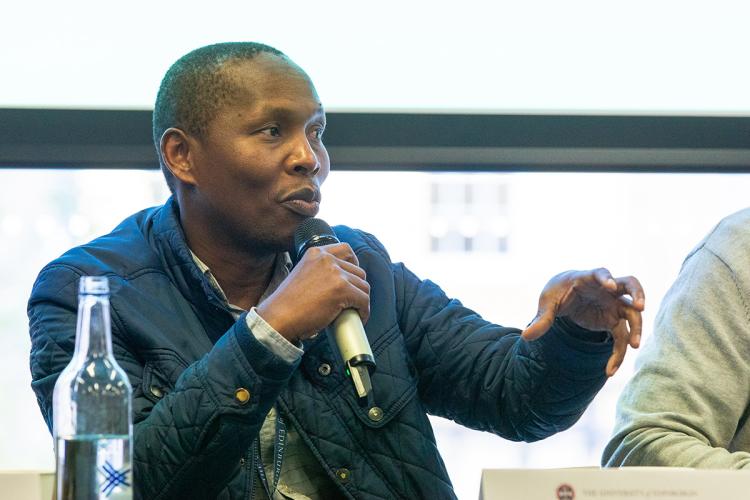 Man speaking into microphone