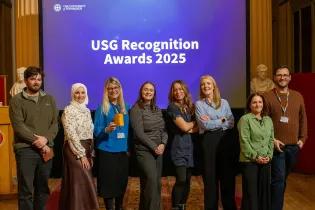 Edinburgh Global colleagues collect their USG Award at Playfair Library