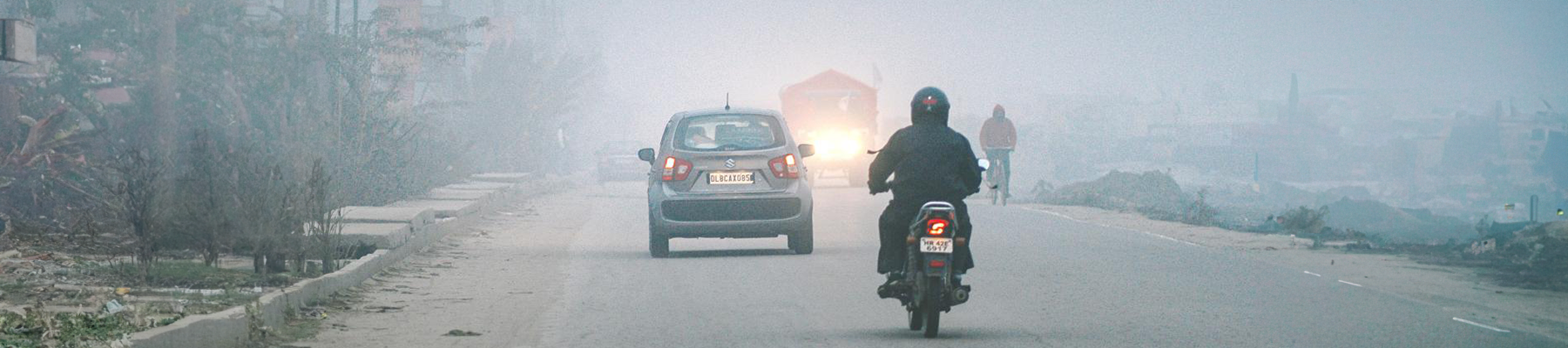 Motorbike driving through pollution