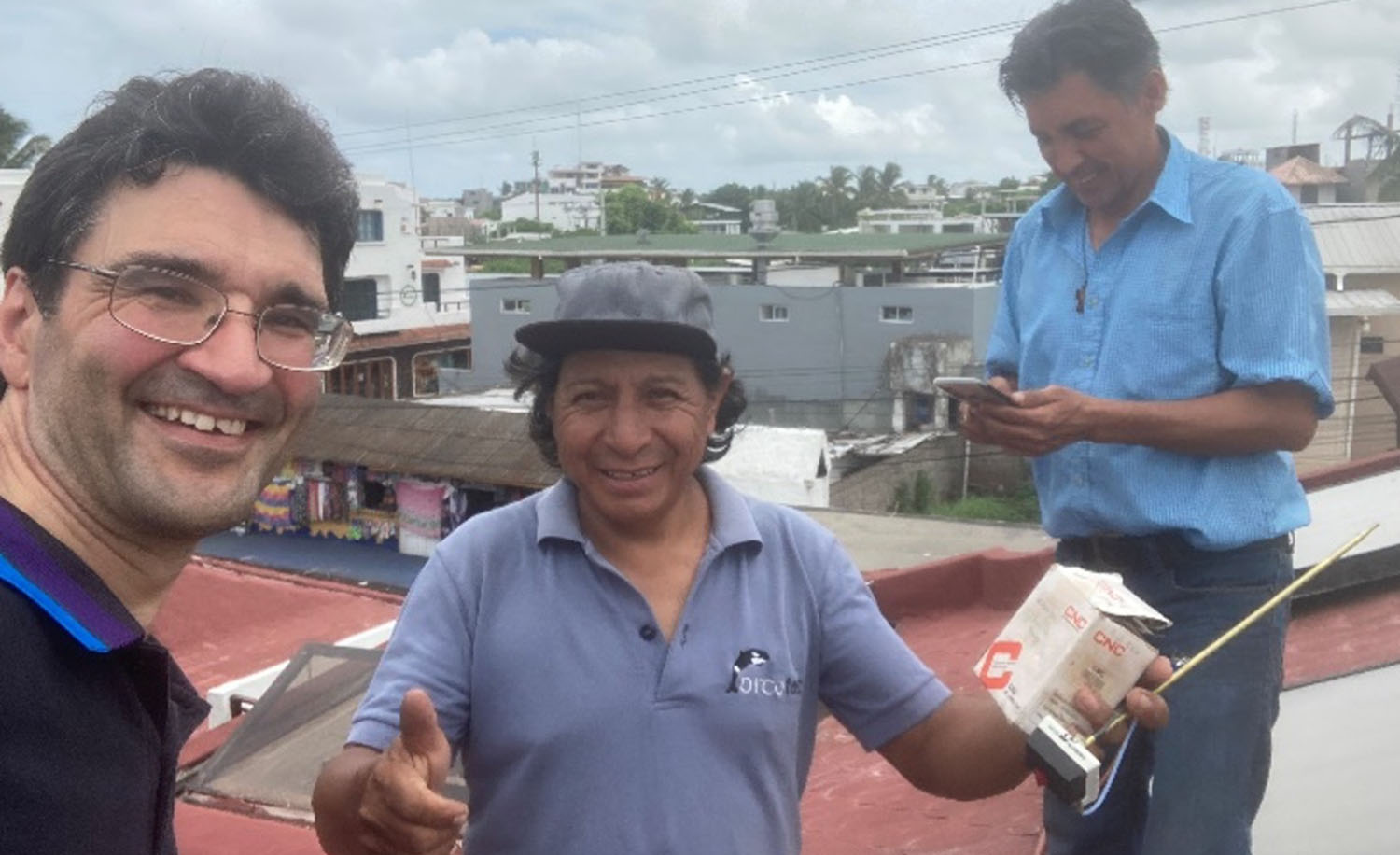 Dimitri Mignard with two colleagues from Orcatec in the Galapagos Islands