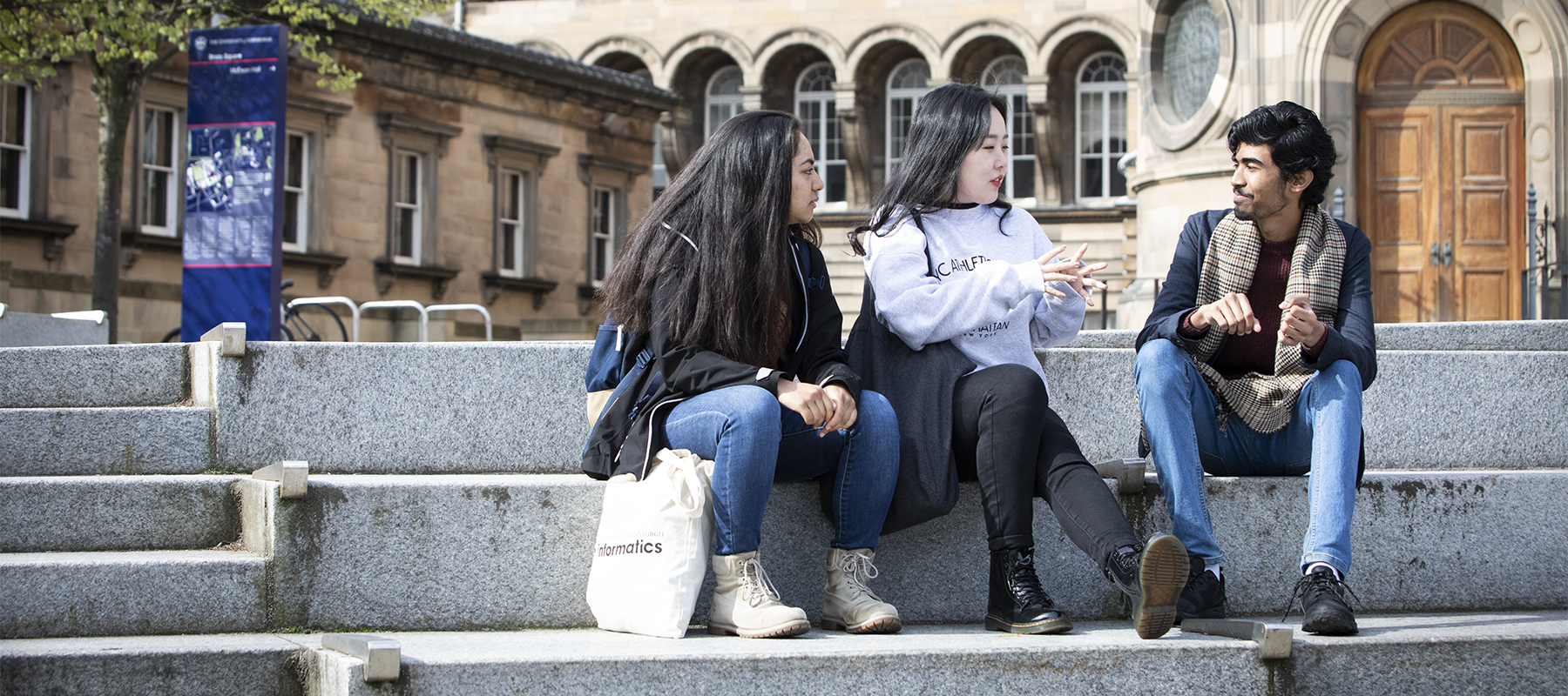 Students sit on steps outside of McEwan Hall