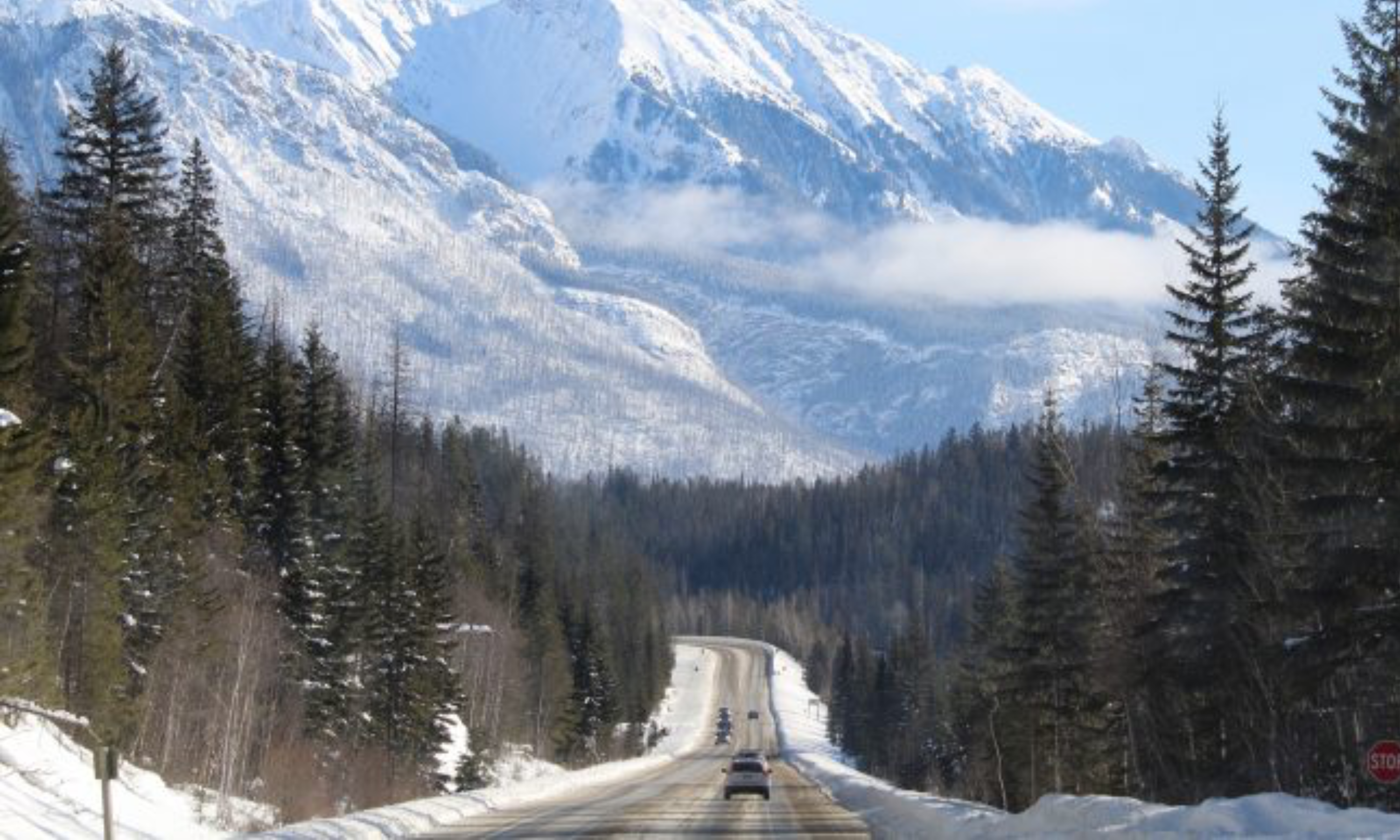 Car driving towards the mountains