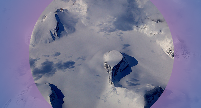Aerial view of snowy mountains in the Arctic